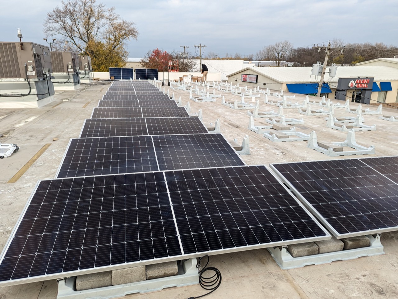 Solar panels and mounting bases during a rooftop installation