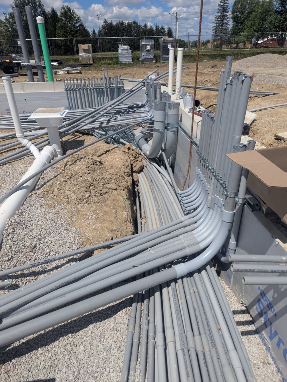 Conduit routes and risers during building construction