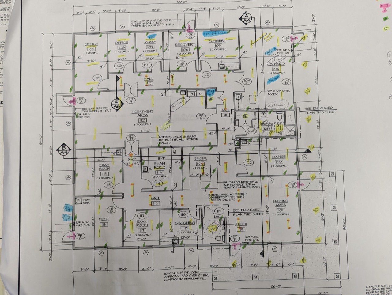 Building floor plan with handwritten electrical notes and highlighted markings